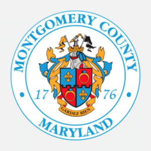 Seal of Montgomery County, Maryland, featuring a coat of arms with fleurs-de-lis and rings, a knights helmet, gold and blue decorations, the text Gardez Bien, and the year 1776. Montgomery County Maryland circles the seal.