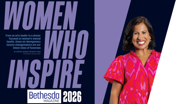 A smiling woman in a bright pink dress stands next to large text reading Women Who Inspire on the cover of Bethesda Magazine 2026.